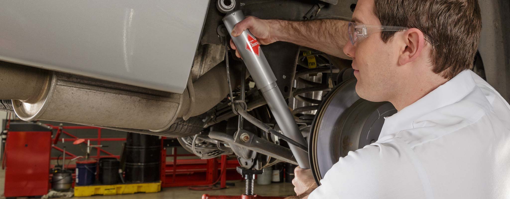 Technician installing a new shock.