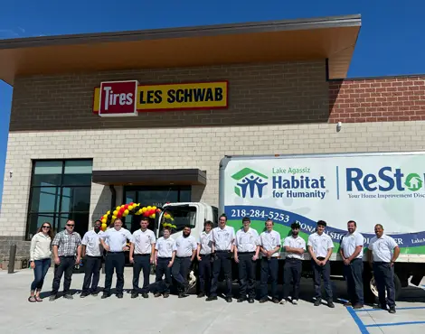 Lake Agassiz Habitat for Humanity truck and team with Les Schwab team