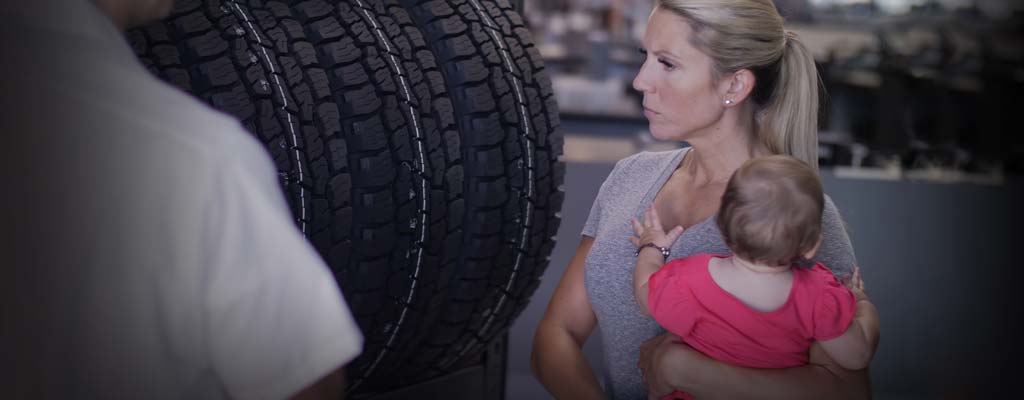 Woman searching for new tires