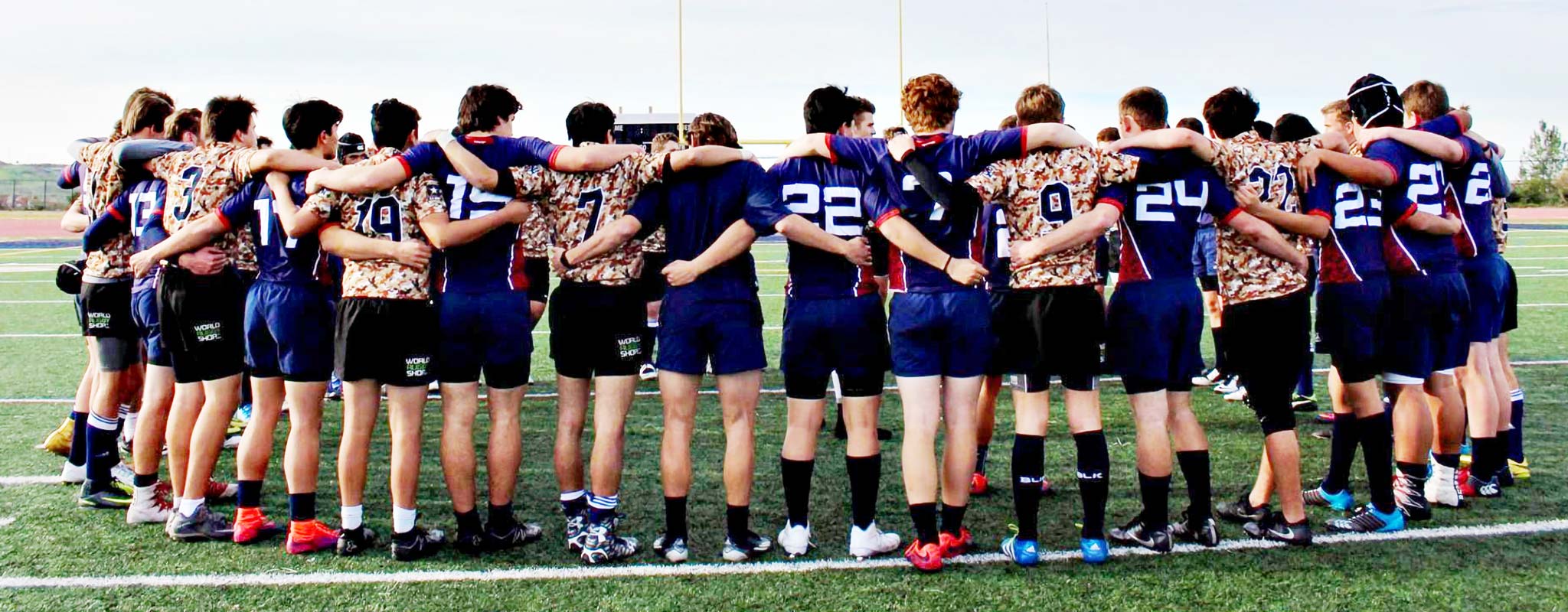 The Great Oak high school rugby team stand united in a scrum.