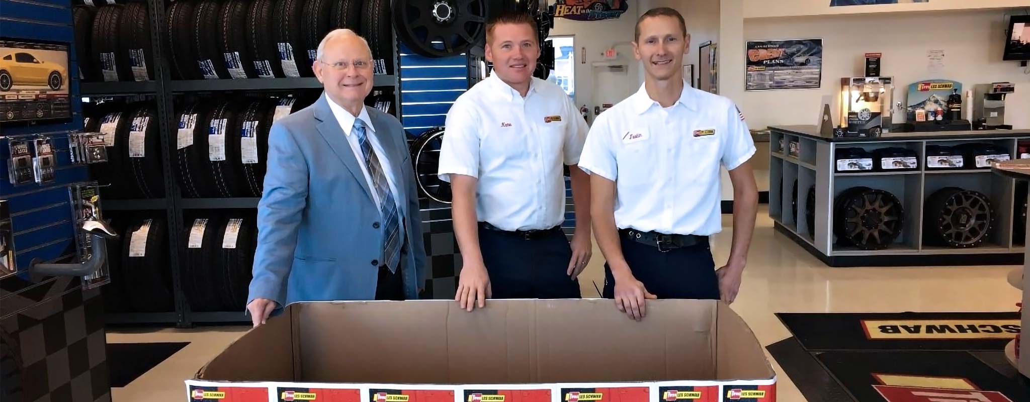 Doug Stephenson, Nathan Thies and Justin Brunson inside a Les Schwab Tire Center.