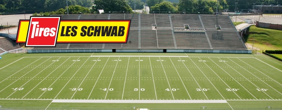 Les Schwab logo overlaid on top of a football field