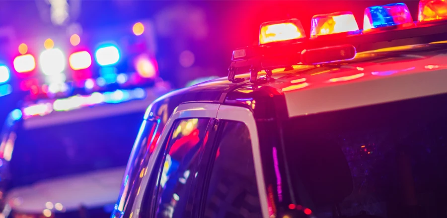 Police vehicles with emergency lights on