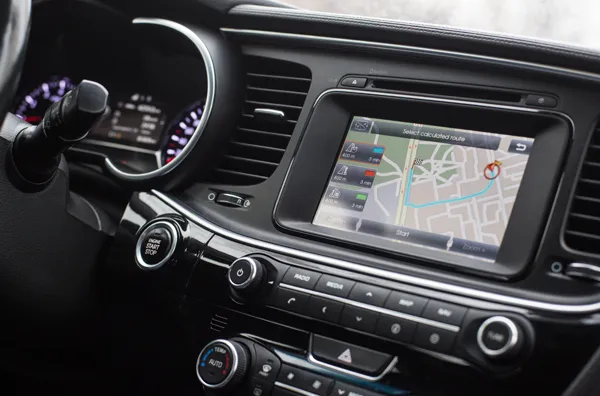 Car dashboard showing the navigation and current route
