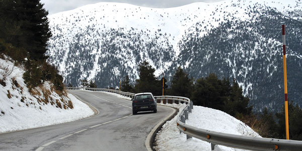 Car traveling downhill on mountain road