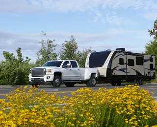 Truck pulling a large camp trailer
