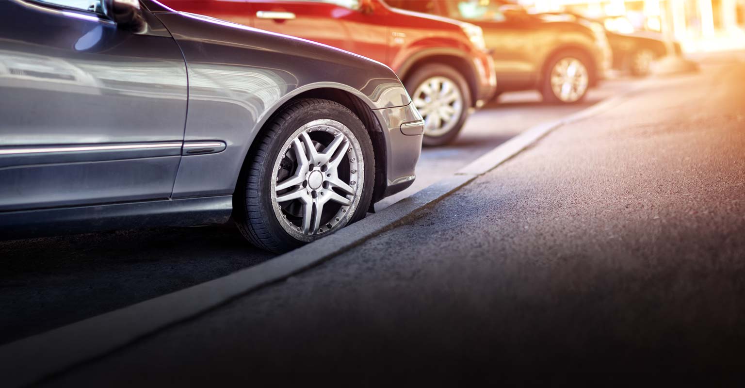 Cars lined up in a parking lot