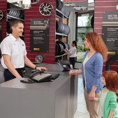 Les Schwab professional greeting a customer