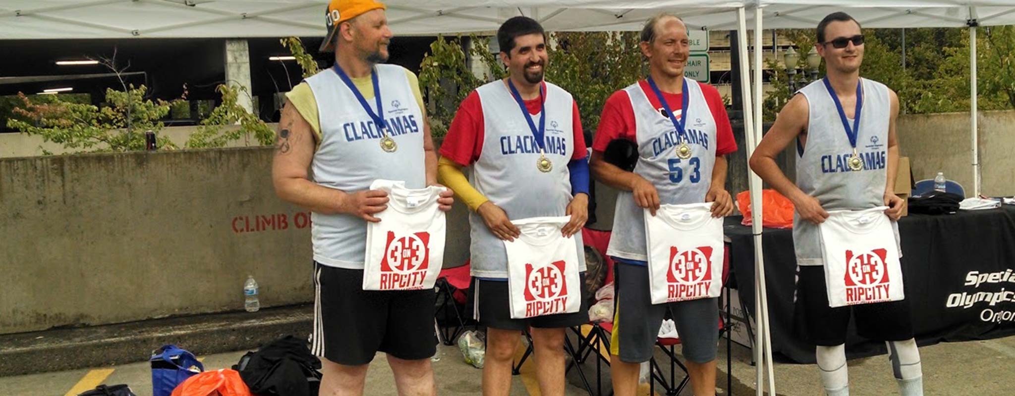 Players posing with their gold medals at the Rip City event.
