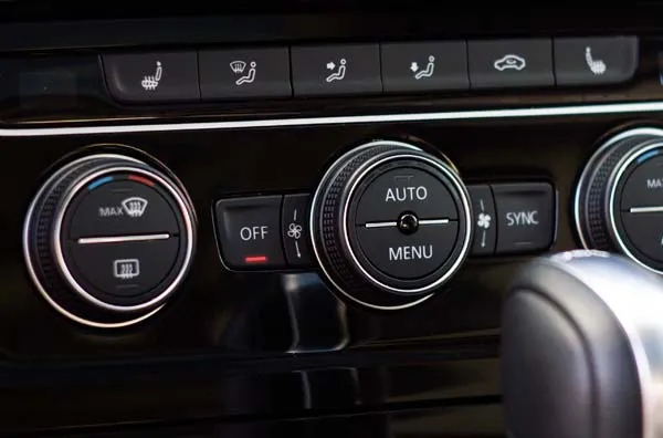 Air conditioning and other buttons on a car dashboard