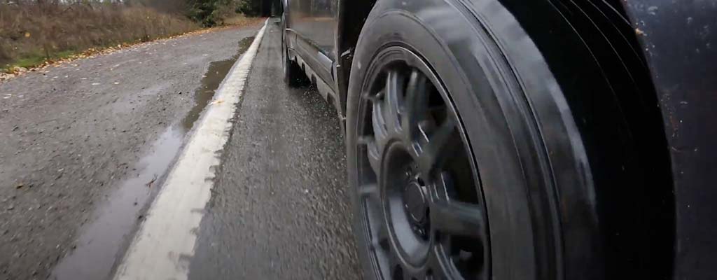 Up close of car tire on wet road