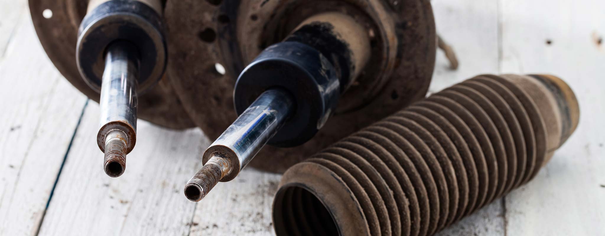 Worn struts with worn boot