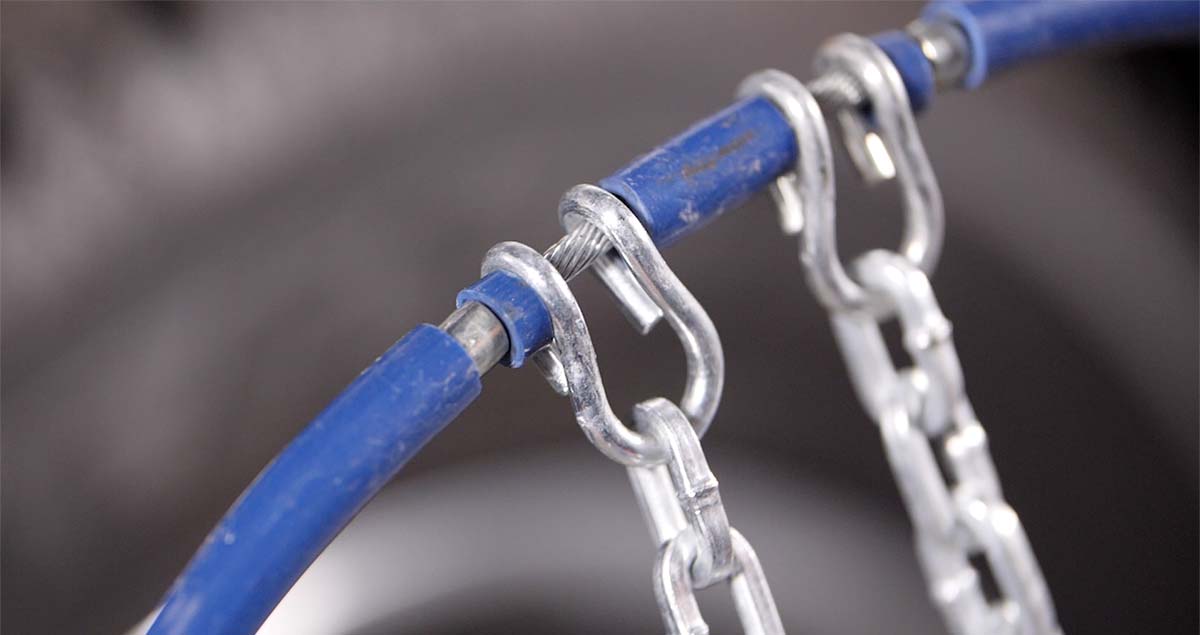 Metal hooks on tire chain pointed away from the viewer.