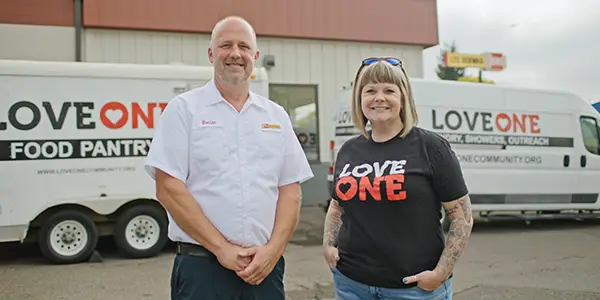 Les Schwab manager with LoveOne's Executive Director